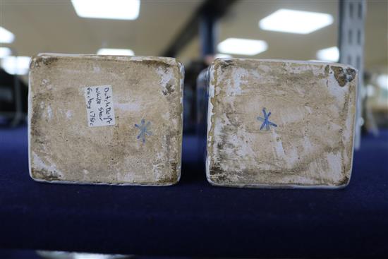 A pair of Dutch delft blue and white lidded tea caddies